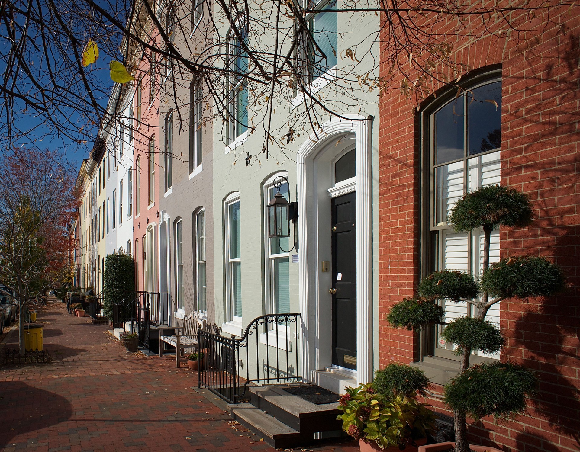 Row of brick houses on a residential street in Baltimore, MD