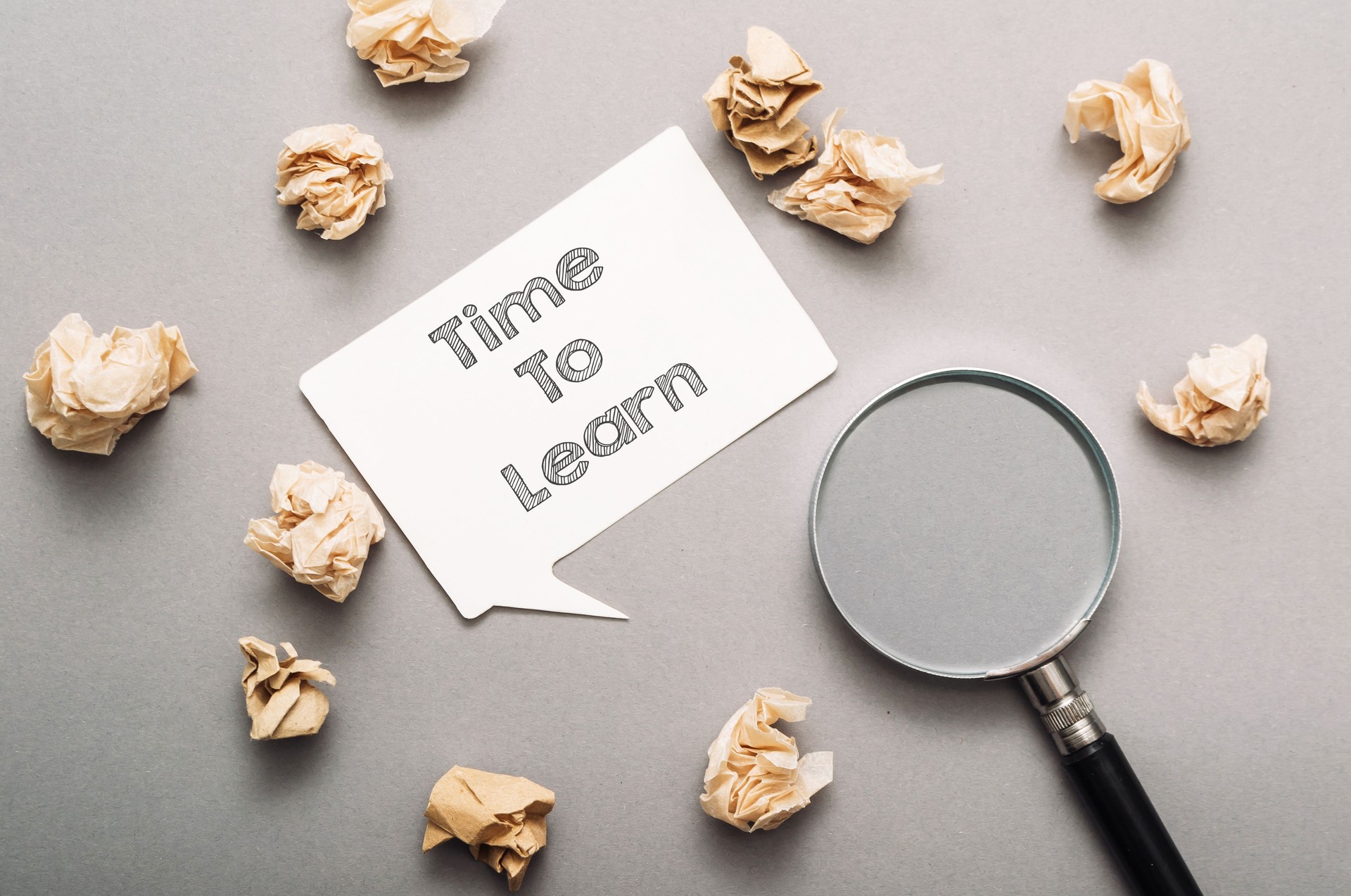 The shredded paper is scattered around the sign, creating a sense of chaos